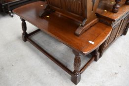 An oak coffee table of traditional design measuring 106cm long 43 wide and 44cm tall