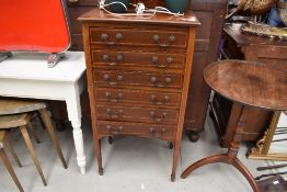 An early 20th Century mahogany and inlaid music cabinet, having six drawers, width approx. 54cm,