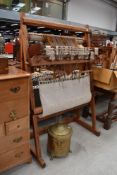 A pitch pine rug makers or fabric weavers loom with accessories