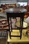 An early 20th Century oak occasional table, approx. height 72cm