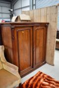 A Victorian mahogany linen cupboard, approx dimensions W130 H140 D54cm