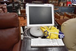 An Apple iMac desktop computer and accesories, serial number W8352078QB6