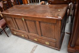 A period oak coffer/kist having four panels over double drawer base, dimensions approx. W150 D55