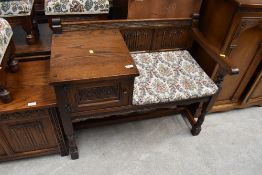 An Old Charm oak framed telephone table with integral drawer