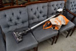 A Dyson cordless vacuum cleaner, sold as faulty as charges and lights but doesnt run, with