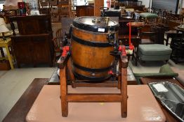 A traditional oak butter churn of small proportions, barrel length approx. 37cm