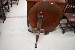 A 19th Century circular tripod table on turned column and triple splay legs, diameter approx.