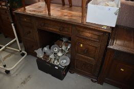 An early to mid 20th Century al desk having leather top