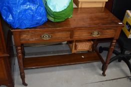 A Victorian mahogany washstand having solid top over two frieze drawers