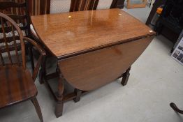 A mid to late 20th Century oak gateleg dining table, width approx. 98cm