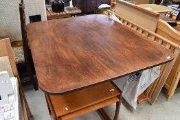 A George III mahogany breakfast table, in the Gillows style , on splay column with brass applique