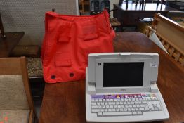 A vintage electronic typewriter, Brother Lw-840ic, with carry bag etc