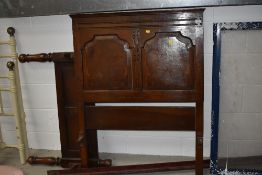 A traditional oak single bed frame and irons