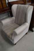 A modern wing backed arm chair
