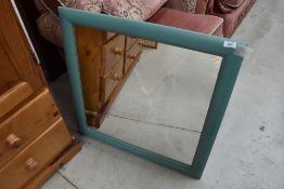 A modern painted wall mirror, approx. 70 x 70cm