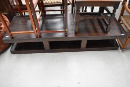 A modern dark stained TV stand or coffee table, approx. dimensions W160cm D52cm H32cm