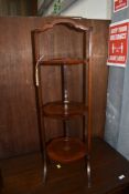 A collapsible Victorian cake stand in mahogany