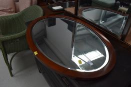 An early 20th Century oval wall mirror