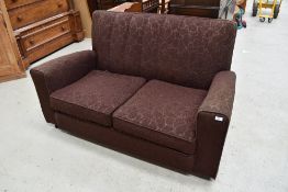 A 1930s settee with original metal casters, finished in brown moquette , good solid frame for a re