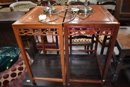A pair of Oriental hardwood occasional tables