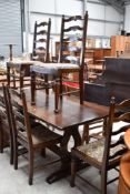 A traditional farm house style kitchen table and set of six chairs in oak table measures 170cm