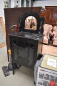 A Victorian ebonised boudoir cabinet, having glazed and fretwork section and mirror back, width