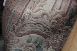 A large Chinese carpet square having pink ground , approx 300 x 214cm