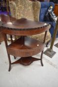 An early 19th Century mahogany corner washstand having fold over top