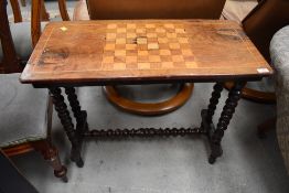 A Victorian chequer board table , having bobbin turned frame and stretcher