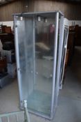A glass fronted display cabinet with integral light