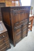 A stained oak cupboard in a traditional design