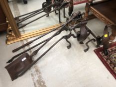 A large set of Arts and Crafts irons in hammered steel in the style of the Spittle Brothers