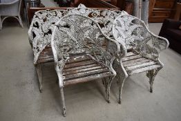 A cast aluminium three piece garden suite set, in the Coalbrookdale style, having fern pattern and