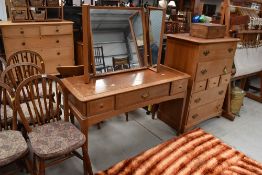 A drawer and dressing table set possibly by Stag in a satin wood