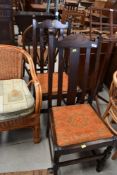 Two antique oak framed dining chairs with slatted backs
