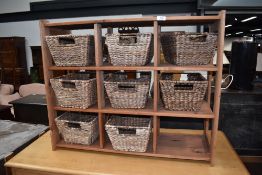 A modern pine 9 compartment storage unit, with 8 baskets, approx. dimensions W84cm H69cm D31cm