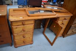 A modern pine twin pedestal dressing table having triptych mirror back, approx. width 138cm, would