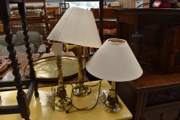 Three modern brass lamps, Corinthian style