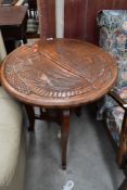 A folding carved table, mythical creature decoration, approx. diameter 60cm