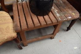 A small pitch pine work table with extending flap