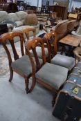 A set of four Victorian mahogany dining chairs, having later green dralon seats