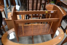 A vintage teak magazine rack
