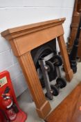 A reproduction cast fire place,and wooden surround
