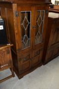 A leaded glass and oak display cabinet by Old Charm 54cm wide 114cm tall and 49cm deep