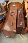 Two vintage leather bound travel trunks or suitcases