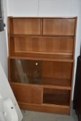 A vintage golden oak bookself having glazed and cupboard sections, width approx. 91cm