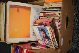 A mixed box of lP records and 45 singles, including pop and rock and roll.