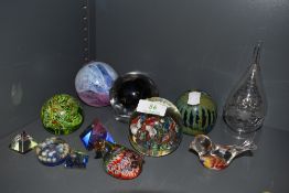A lot of eleven paper weights including Mdina glass.
