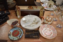 A selection of Chinese items including two soap stone figures two export plates and a cinnabar