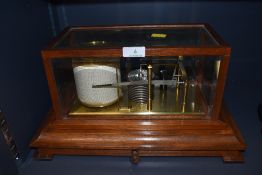 A vintage mahogany cased Negretti and Zambra model 4134 Barograph, having bevelled glass sides and